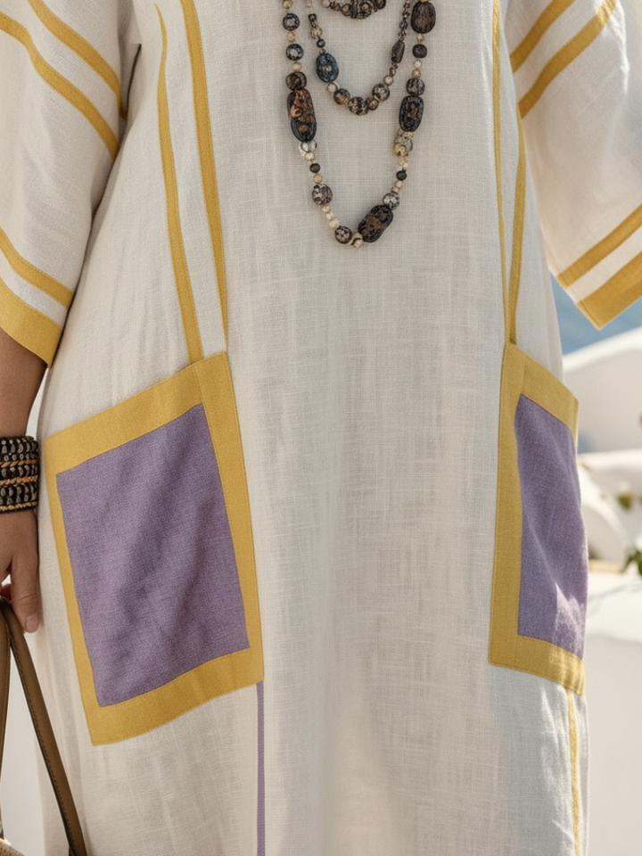 Zafira | Elegant long dress with a V-neck, short sleeves and practical pockets
